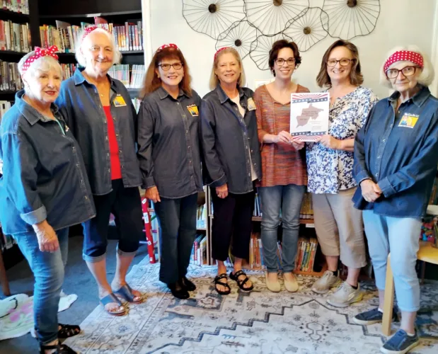 Rosie the Riveter group donates book to library